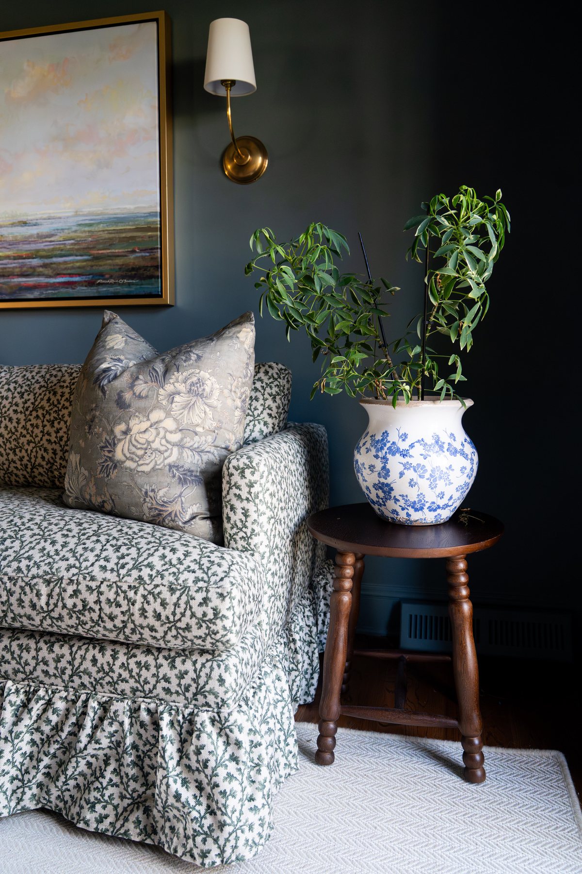Patterned block-print throw pillow on a floral sofa