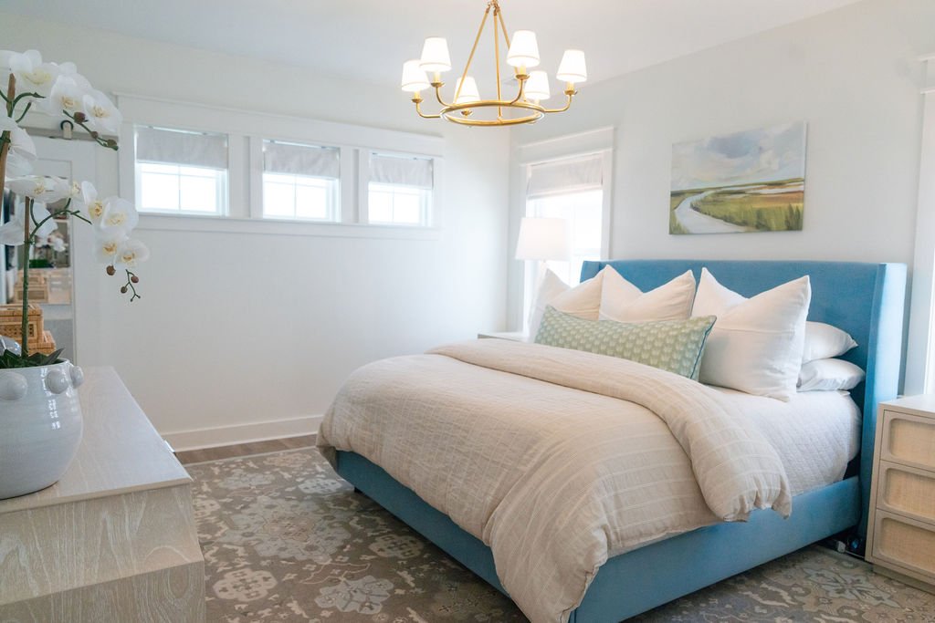 Vintage-inspired hand-knotted wool rug in a Charleston primary bedroom
